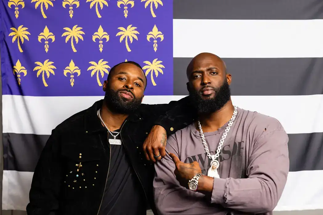 Two men photographed together at a media appearance